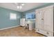 Bedroom with twin beds, desk, and ample closet space at 1985 Fairview Dr, Englewood, FL 34223