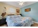 King-size bed, coastal decor, and ceiling fan in this bedroom at 1985 Fairview Dr, Englewood, FL 34223