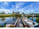 Boat dock with lift and scenic waterway views at 1985 Fairview Dr, Englewood, FL 34223