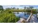 Wooden dock offering serene waterfront views at 1985 Fairview Dr, Englewood, FL 34223