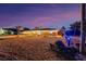 Single-story home with brick paver driveway and boat parking at dusk at 1985 Fairview Dr, Englewood, FL 34223