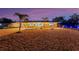 Single-story home with brick paver driveway and boat parking at dusk at 1985 Fairview Dr, Englewood, FL 34223