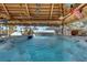 Relax in this large hot tub under a shaded tiki hut at 1985 Fairview Dr, Englewood, FL 34223