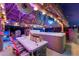 Relaxing hot tub under a covered patio at night at 1985 Fairview Dr, Englewood, FL 34223