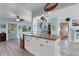 Open concept kitchen features granite countertops and island with seating at 1985 Fairview Dr, Englewood, FL 34223
