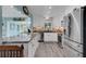 Updated kitchen with granite countertops, stainless steel appliances, and white cabinetry at 1985 Fairview Dr, Englewood, FL 34223