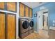 Laundry room with washer, dryer and storage at 1985 Fairview Dr, Englewood, FL 34223