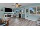 Living room with light gray floors and blue walls at 1985 Fairview Dr, Englewood, FL 34223