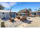 Outdoor patio with firepit and tiki hut at 1985 Fairview Dr, Englewood, FL 34223
