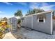 Two storage sheds, one gray and one black, in the backyard at 1985 Fairview Dr, Englewood, FL 34223