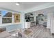 Sunroom with view of kitchen and living areas at 1985 Fairview Dr, Englewood, FL 34223