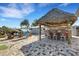 Outdoor Tiki bar with seating and colorful details at 1985 Fairview Dr, Englewood, FL 34223
