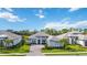 Luxury home with gray roof and landscaping, in a quiet neighborhood at 19854 Bridgetown Loop, Venice, FL 34293