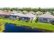 Aerial view of homes showcasing pools, screened enclosures, and green lawns at 19854 Bridgetown Loop, Venice, FL 34293