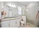 Bathroom with shower, toilet, and granite countertop at 19854 Bridgetown Loop, Venice, FL 34293