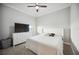 Bright bedroom with a large bed and dresser at 19854 Bridgetown Loop, Venice, FL 34293