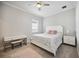 Bedroom with vanity, queen bed, and ceiling fan at 19854 Bridgetown Loop, Venice, FL 34293