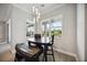 Breakfast nook with a table and bench seating near window at 19854 Bridgetown Loop, Venice, FL 34293