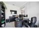 Home office features a large desk and built-in shelving at 19854 Bridgetown Loop, Venice, FL 34293