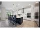 Modern kitchen with island, stainless steel appliances, and white cabinets at 19854 Bridgetown Loop, Venice, FL 34293
