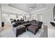 Open living space featuring a large sectional sofa and kitchen views at 19854 Bridgetown Loop, Venice, FL 34293
