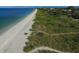 Aerial view of pristine beach and shoreline at 199 Palm Air Dr, Osprey, FL 34229
