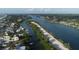 Aerial view showcasing waterfront homes, lush greenery, and a tranquil waterway at 199 Palm Air Dr, Osprey, FL 34229