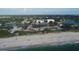 Aerial perspective of beach, coastline, and tranquil waters at 199 Palm Air Dr, Osprey, FL 34229