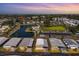 Waterfront community with homes, parking, and boats at 199 Palm Air Dr, Osprey, FL 34229