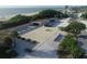 Aerial view of a beach pavilion with ample parking and beach access at 199 Palm Air Dr, Osprey, FL 34229