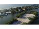 Aerial view of beach access and residential properties near the coastline at 199 Palm Air Dr, Osprey, FL 34229