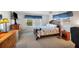 Spacious bedroom with dresser, nightstand and ceiling fan at 199 Palm Air Dr, Osprey, FL 34229