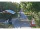 Paved bike trail with shaded areas and resting spots at 199 Palm Air Dr, Osprey, FL 34229