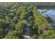 Aerial view of a bike path next to a tranquil lake at 199 Palm Air Dr, Osprey, FL 34229