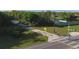 Aerial view of a paved bike trail near a tranquil lake at 199 Palm Air Dr, Osprey, FL 34229