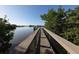 Scenic boardwalk path offering tranquil views of the water at 199 Palm Air Dr, Osprey, FL 34229
