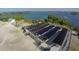 Aerial view of a boat storage facility with numerous boats under covered parking at 199 Palm Air Dr, Osprey, FL 34229