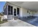 Side view of the mobile home showing the carport and entrance at 199 Palm Air Dr, Osprey, FL 34229