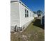 Side view of a white single wide manufactured home at 199 Palm Air Dr, Osprey, FL 34229