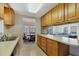 View of kitchen, dining area, and living room from kitchen at 199 Palm Air Dr, Osprey, FL 34229