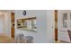 Kitchen features breakfast bar and pass-through to dining area at 199 Palm Air Dr, Osprey, FL 34229