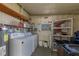 Laundry room with washer, dryer, and storage shelves at 199 Palm Air Dr, Osprey, FL 34229