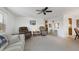 Spacious living room featuring comfortable seating and a view into the kitchen area at 199 Palm Air Dr, Osprey, FL 34229
