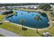 Aerial view of a peaceful pond in the community at 199 Palm Air Dr, Osprey, FL 34229