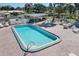 Community pool with patio and seating at 199 Palm Air Dr, Osprey, FL 34229