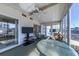 Bright sunroom with seating, a TV, and large windows at 199 Palm Air Dr, Osprey, FL 34229