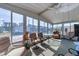 Relaxing sunroom with ample seating and views of the surrounding neighborhood at 199 Palm Air Dr, Osprey, FL 34229