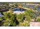 Bird's-eye view of a house nestled in a lush, waterfront community at 20 Saint Croix Way, Englewood, FL 34223