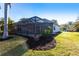 Spacious backyard featuring a screened-in pool area, perfect for outdoor relaxation and entertainment at 20 Saint Croix Way, Englewood, FL 34223