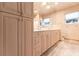 Bathroom with double vanity and large mirror at 20 Saint Croix Way, Englewood, FL 34223